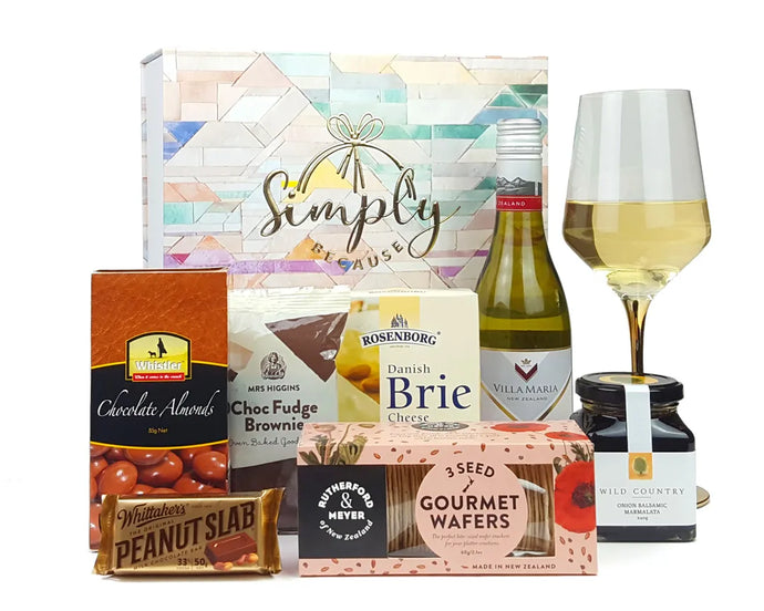 Giftbox with food and wine in front