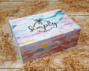 Simply Because coloured gift box exterior on straw background