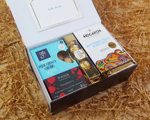 Open gift box with chocolate inside