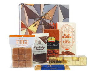Giftbox with sweet treats in front
